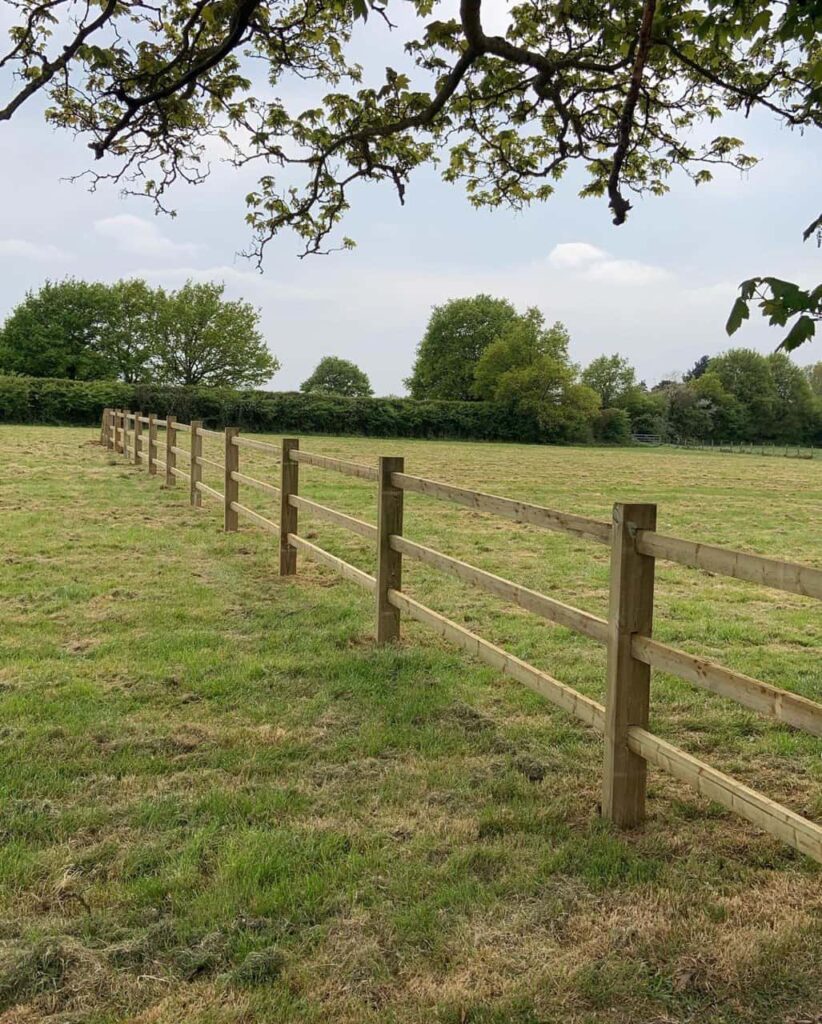 This is a photo of a post and rail fence installed in a field by Fast Fix Fencing Fordham